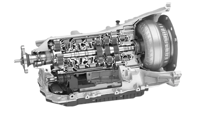 Detailed view of a rebuilt transmission being inspected before installation.